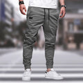 Grønne joggebukser for menn, komfortabel passform, elastisk midje, snøring, moderne stil. Perfekt for hverdagsbruk og fritidsaktiviteter.